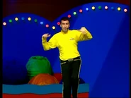 Greg standing on one foot and shaking his hands