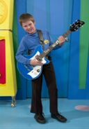 Little Anthony playing his blue Maton electric guitar