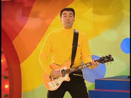 Greg playing his yellow Maton electric guitar in "Top of the Tots"