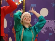 Corrine as an elf in Yule Be Wiggling