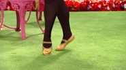 Fairy Clare's legs and feet Irish dancing with yellow sparkly/glittery Irish dancing fairy shoes