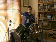 Anthony playing drums