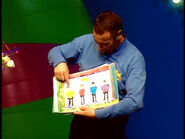 Anthony showing portraits of the Wiggles