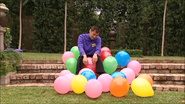 Jeff sleeping on a pile of balloons"