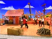 Captain Feathersword and Wags dancing The Doggy Polka