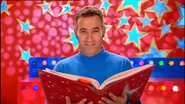Anthony holding a book