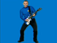 Anthony playing his blue Maton electric guitar in "Getting Strong!" promo picture