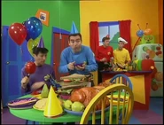 Anthony eating apple slices in "The Party"