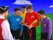 The Wiggles looking at a counting book