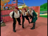 The pirates blowing Captain Feathersword down