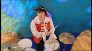 Captain Feathersword playing the drums