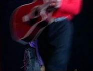 The red Takamine Acoustic EF325SRC guitar