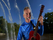 Anthony playing mini Maton acoustic guitar