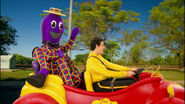 Sam and Henry in the Big Red Car outside