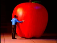 Anthony eating big apple in "LIVE Hot Potatoes!"
