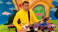 Greg playing his yellow Maton electric guitar in "It's Time to Wake Up Jeff!"