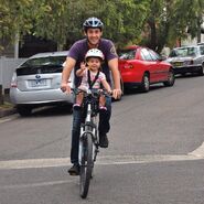 Sam and Eloise riding on bike