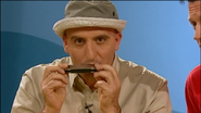 Alfonso playing his harmonica