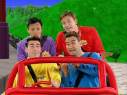 The Other Wiggles pointing to Greg