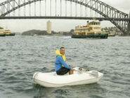 Anthony rowing a boat