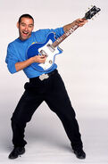 Anthony playing his blue Maton electric guitar