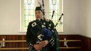 Anthony playing the bagpipes