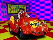 Captain Feathersword driving the Big Red Car