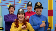 The Wiggles wearing police hats