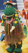 Dorothy in a hula skirt and lei (Dorothy the Dinosaur's Beach Party!)