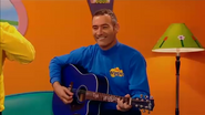 Anthony playing his blue Maton acoustic guitar in Wiggly Friends