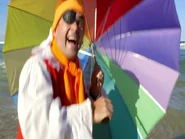 Captain holding umbrella