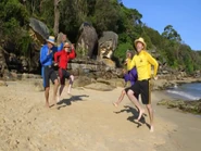 The Wiggles wearing sun hats and shorts