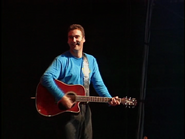 Anthony playing red Takamine guitar in The Wiggles Big Show