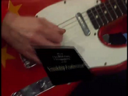 The song's title card landing on the Fender American Vintage Telecaster ("Red Starry Guitar")