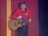 Murray playing his guitar