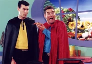 A promo picture of Anthony serving Greg pizza