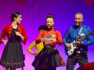 The full female outfit during a live concert in 2023.