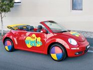 The Volkswagen Big Red Car on the road