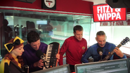 Anthony playing the blue Maton mini acoustic guitar on "Fitzy and Wippa"