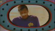 Jeff waking up under beach umbrella