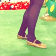 Fairy Larissa's legs and feet tapping on the floor/ground with yellow sparkly/glittery Irish dancing fairy shoes in "Bucket Of Dew/Paddy Condon From Cobar" (2007)
