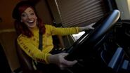 Emma driving a bus