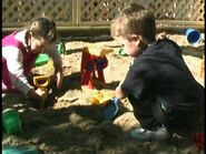 Simon and Jessica digging in the sandpit