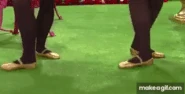 Fairy Clare and Fairy Larissa's legs and feet tapping on the floor/ground with yellow sparkly/glittery Irish dancing fairy shoes in "Bucket Of Dew/Paddy Condon From Cobar" (2007)