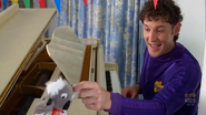 Lachy tickling the puppet koala