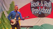 Anthony playing the banjo in "Rock & Roll Preschool Tour!"