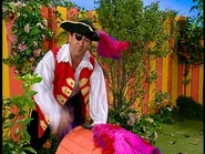 Captain Feathersword holding a treasure chest