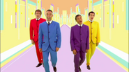 The Wiggles vocalizing while in their Beatles suits