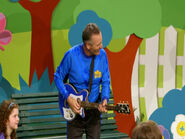 Anthony playing his blue Maton electric guitar in "Wiggly Showtime"