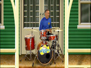 Anthony playing drums in Sing a Song of Wiggles